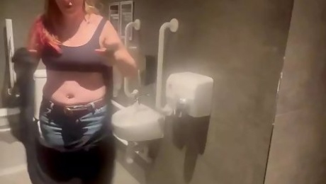 Stepmom joins horny stepson in cinema toilet to help release his big build up flashes him and sucks his Cock